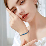 SnapPal Orbit Smart Bracelet — blue rainbow worn
